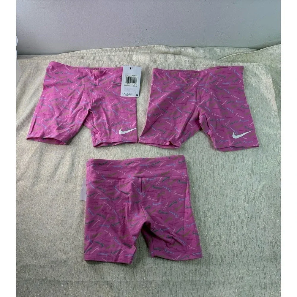 Three pairs of pink Nike biker shorts, size 6X and 6